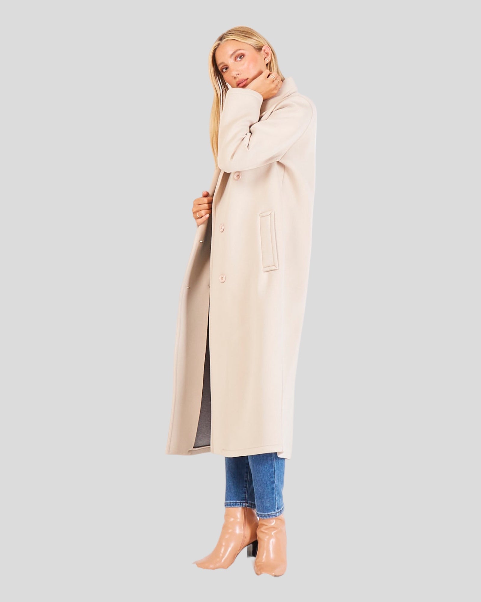 Classic Italian Long Overcoat. This sophisticated overcoat is characterized by a double-breasted design with six buttons and two convenient pockets. Crafted from a blend of faux wool and acrylic, it combines style and comfort seamlessly. Color Natural/Beige