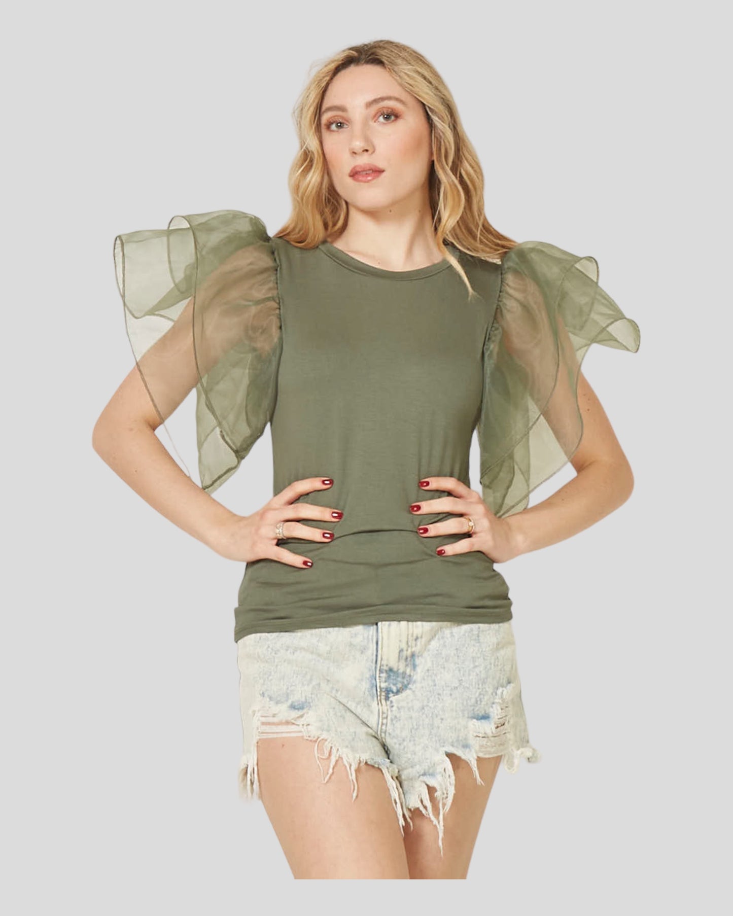 Short Sleeve T-Shirt with Tulle Ruffles, meticulously crafted to make a fashionable statement. The t-shirt boasts high-quality fabric with a slight stretch, ensuring both comfort and style. Short sleeves and delicate tulle ruffles add a touch of elegance, making it the perfect choice for the spring and summer seasons