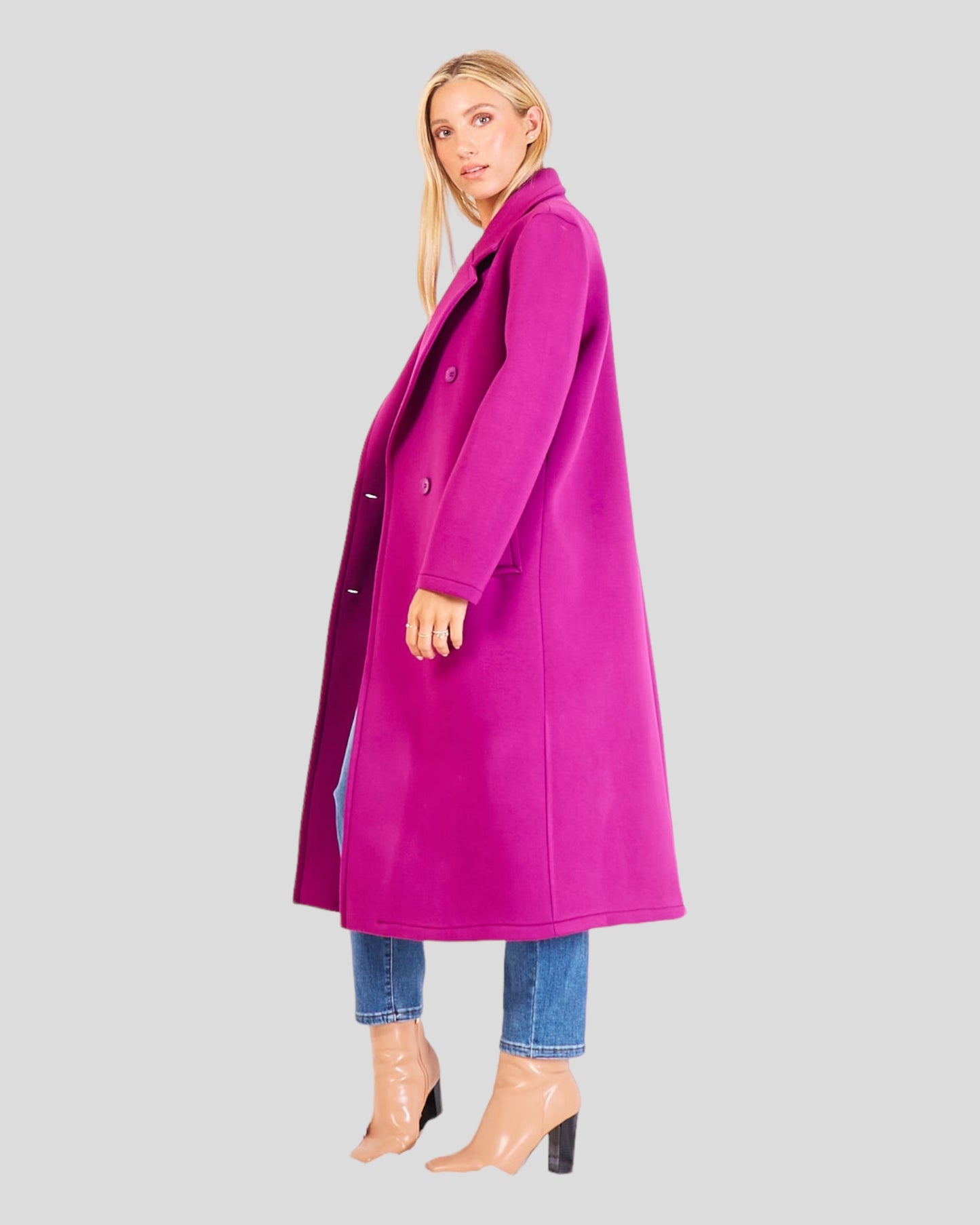 Classic Italian Long Overcoat. This sophisticated overcoat is characterized by a double-breasted design with six buttons and two convenient pockets. Crafted from a blend of faux wool and acrylic, it combines style and comfort seamlessly. Color Magenta