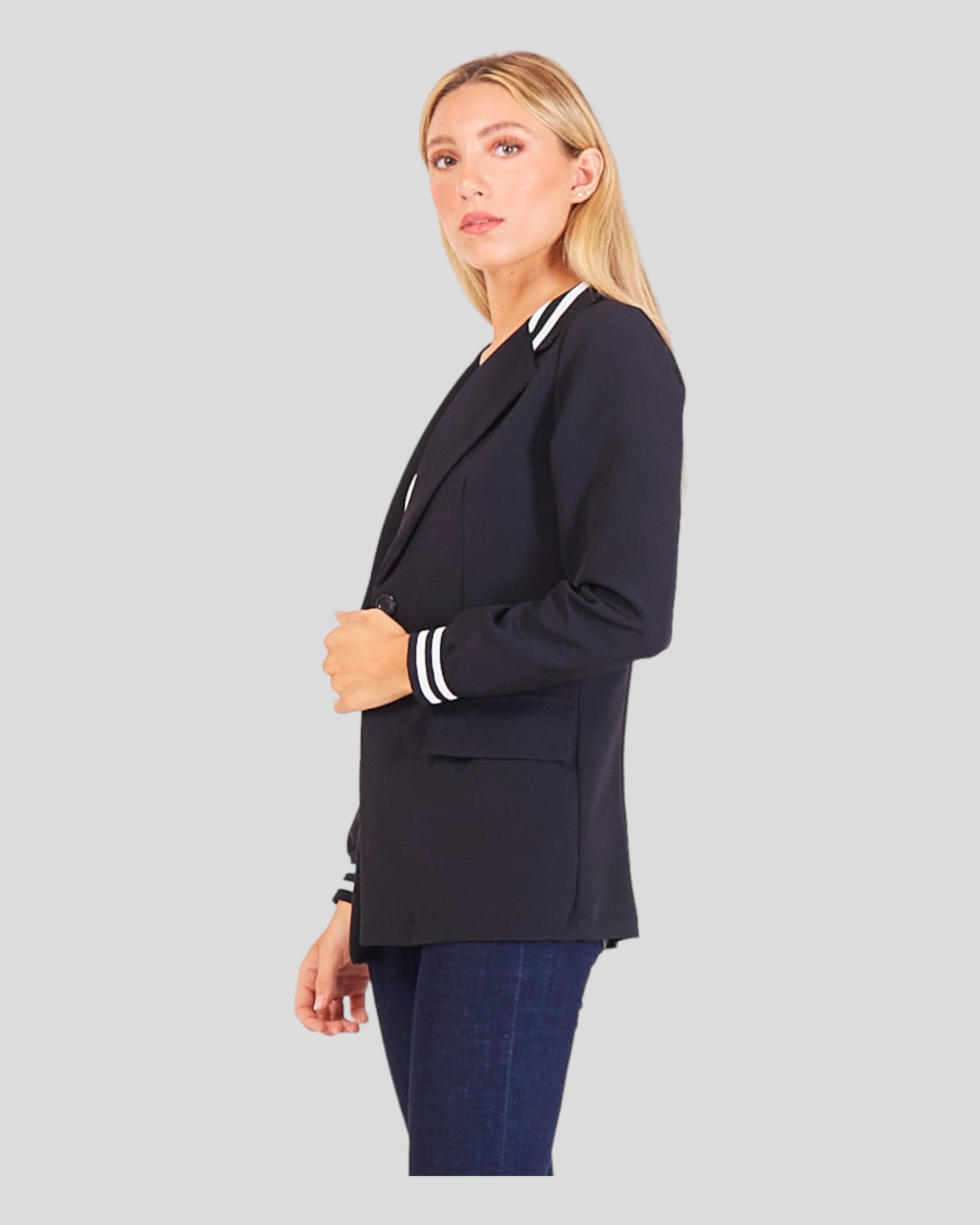 This image presents a Casual Sporty Blazer designed for effortless chic. Crafted from a light blend of cotton and viscose, it ensures comfortable wear. The blazer features distinctive stripes on the cuffs and collar, adding a sporty vibe to the overall look. The long collar contributes to a contemporary touch, while a one-button closure offers versatility and ease of wear.