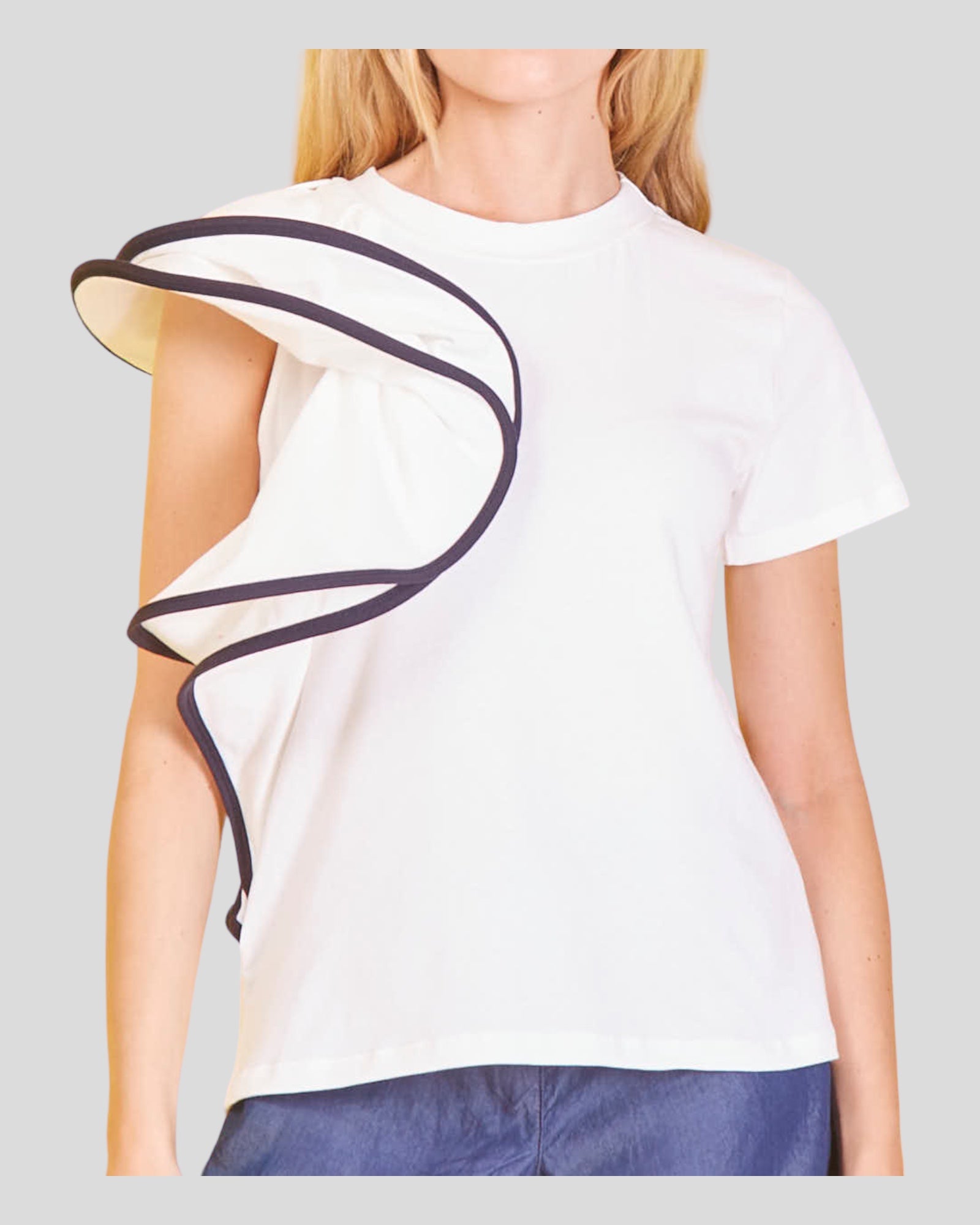 Short Sleeve T-Shirt that exudes luxury and fashion-forward elegance. The standout feature is the gracefully adorned sleeve with ruffles, transforming this t-shirt into a unique and stylish garment. Crafted from comfortable cotton fabric with a slight elasticity, it offers a soft touch against the skin and ensures a perfect fit. 