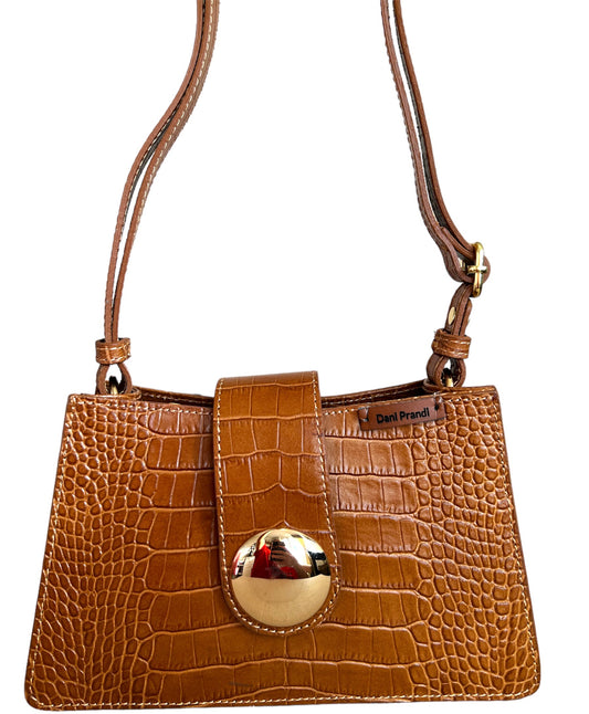 This is a sophisticated genuine leather shoulder bag handbag, a timeless accessory crafted with the finest materials. The bag features a classic design in medium brown, providing both elegance and versatility. With an adjustable shoulder strap and secure zip closure, it seamlessly combines style and practicality.