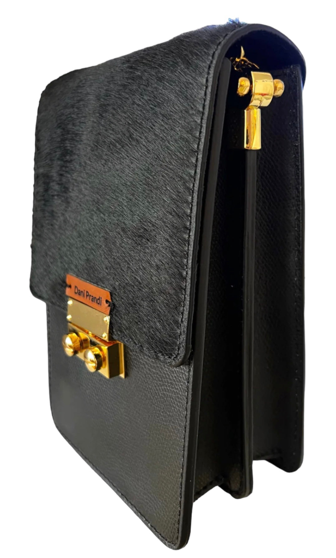 Elegant Evening Bag in black, crafted from real leather and adorned with calf hair for a touch of luxury. The bag showcases timeless sophistication, with a secure button closure and a golden shoulder strap adding a glamorous touch. The dual compartments inside offer practical organization for essentials, making it perfect for important evenings