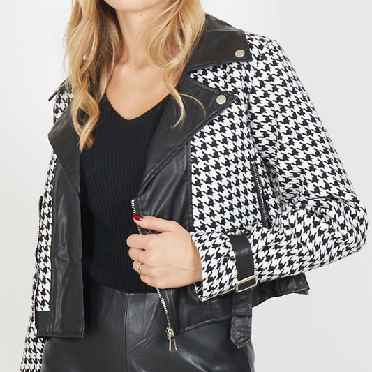 Short Houndstooth Jacket. Designed for versatility, this Italian-made piece showcases a timeless pattern. The jacket is equipped with a sleek zipper closure and is available in a range of sizes to ensure a perfect fit. Houndstooth black and white